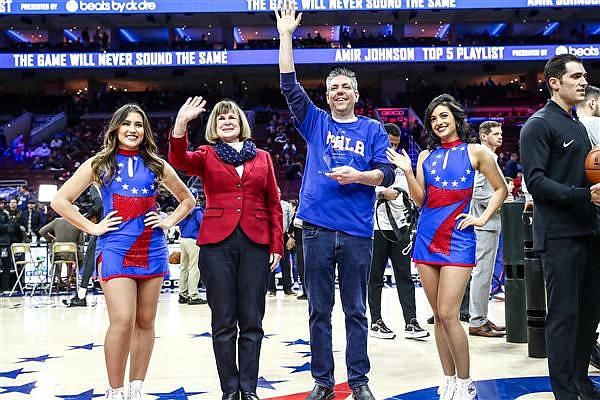 Matt Scott, center right, being honored by the Philadelphia 76ers. 