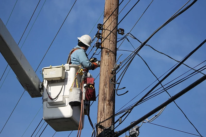 A PECO worker disables electric service to a house. File photo. 