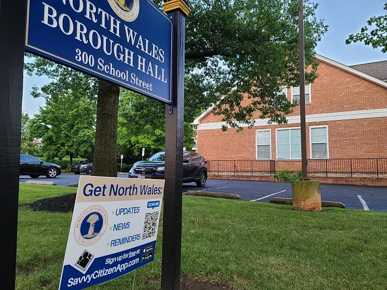 A sign indicating how to sign up for the “Savvy Citizen” app stands outside North Wales Borough Hall on Tuesday, July 25, 2023. 