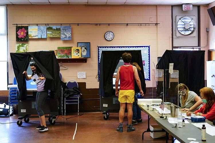 A voter steps from the voting booth after casting a ballot in the Pennsylvania primary in Philadelphia, Tuesday, May 18, 2021. 