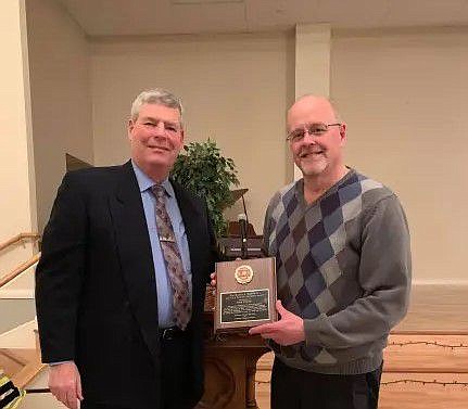 John Strobel. right, receives the North Penn Volunteer Fire Company’s “Spirit of a Volunteer Firefighter Award” at a fire company banquet in 2019. 