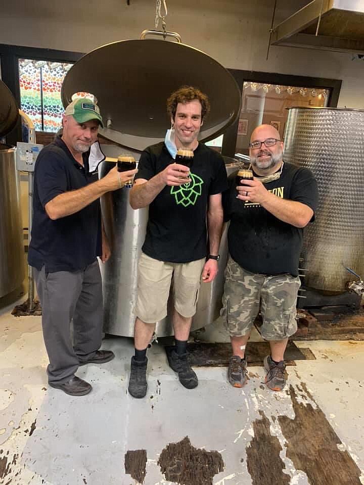 Brian Derbyshire, co-owner of Round Guys, left, Rick Solomon, co-owner and Head Brewer of Well Crafted, center, and Scott Rudich, co-owner of Round Gu