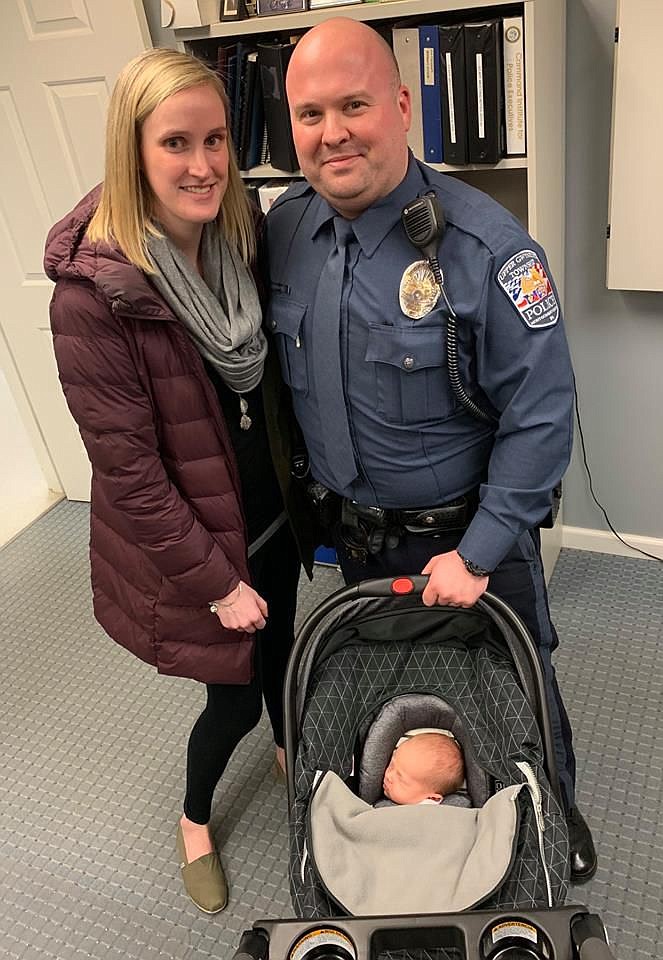 Officer Michael Romanowicz with wife, Jackie, and daughter, Brynn Kathleen. 