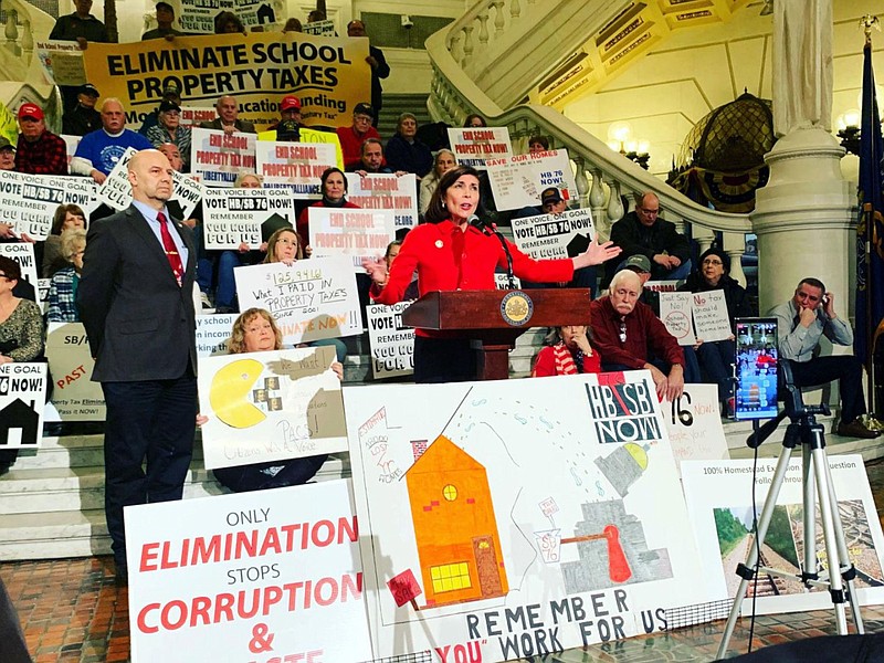 Pennsylvania state Sen. Kristin Phillips-Hill (center) addresses a rally Feb. 3, 2020, on property taxes as Sen. Doug Mastriano (left) looks on. 