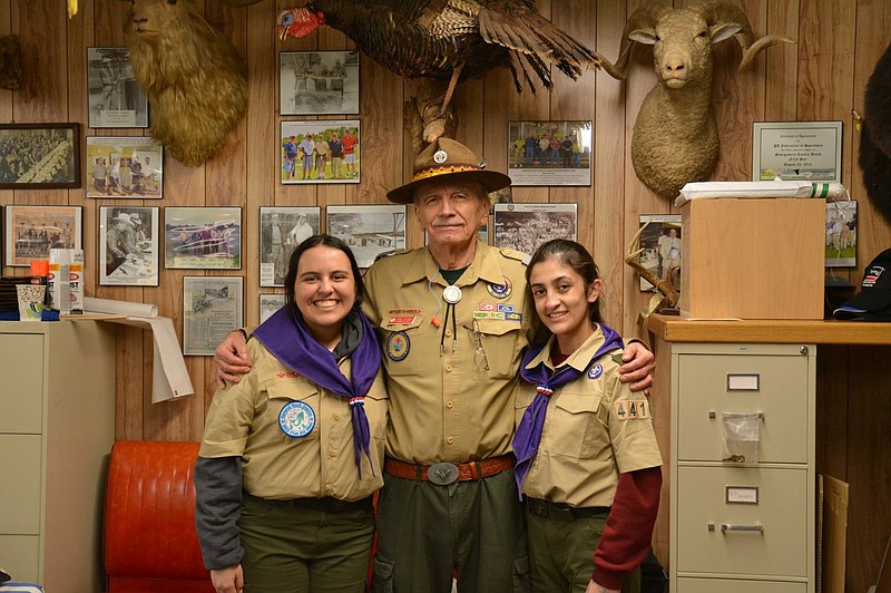 BSA Troop 4414 Scouts Amy Nova Alarcon (left) and Emily Whelchez pose with Merit Badge Counselor Paul Decker after earning the Shotgun Merit Badge 