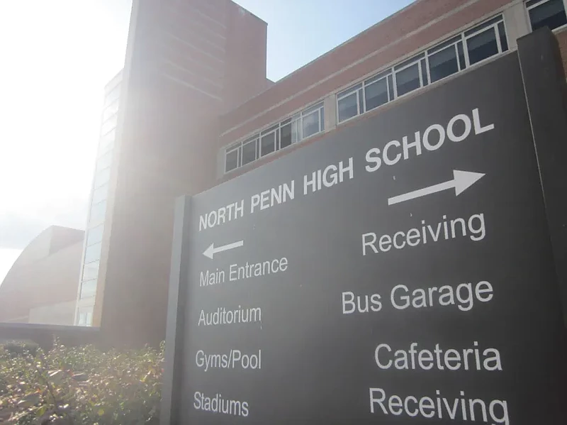 A directional sign indicates which way to go for students and staff arriving at North Penn High School. 