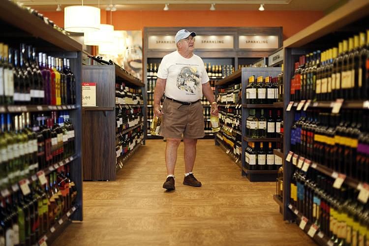 In this July 22, 2010, photo, a shopper perused the selection at at a state wine and liquor store in New Hope, Pennsylvania. 