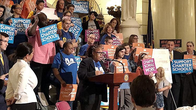 Markida Ross, mother of a student at Mastery's Grover Cleveland Elementary School in Philadelphia, addresses a rally of school choice supporters Sept.