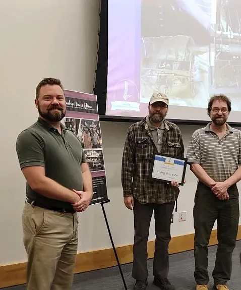 Councilman Mark Ladley, left, poses with Bryan, center, and Keith Winship after presenting the borough’s Business of the Month award to Winship’s Piec