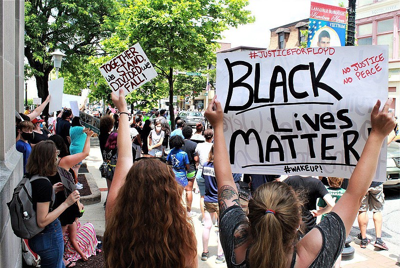 A protester holds up a Black Lives Matter sign during a demonstration on Main Street in Lansdale on June 20, 2020. 