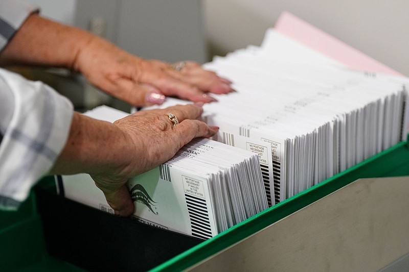 Mail-in ballots are sorted in Allentown, Pa. in 2022. A new bill would give counties more time to prep these ballots. 