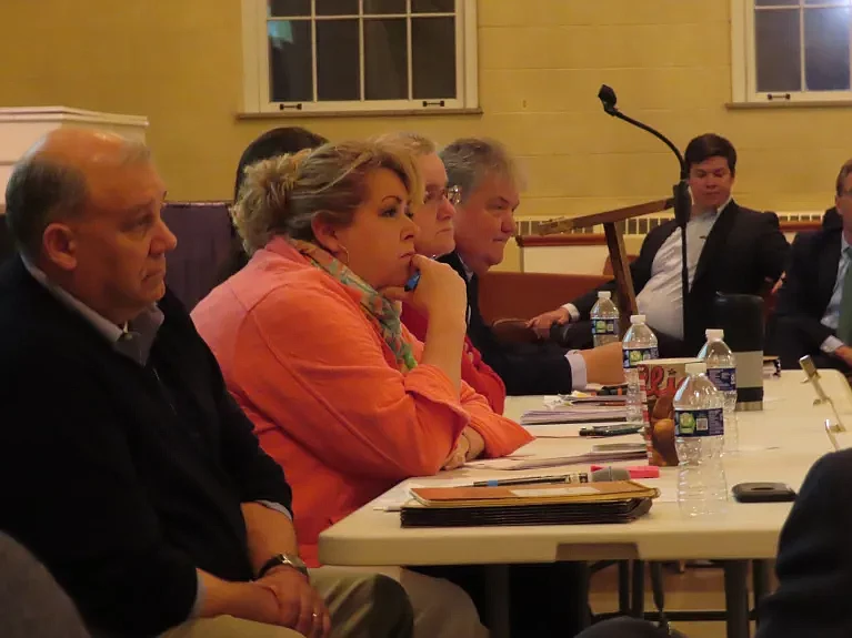 Towamencin supervisors Rich Marino, Laura Smith, Joyce Snyder, and Chuck Wilson listen to comments on the sale of the township’s sewer system during a