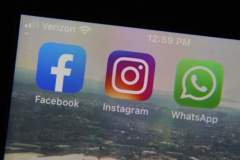 This Tuesday, Oct. 5, 2021, file photo shows the mobile phone app logos for, from left, Facebook, Instagram and WhatsApp in New York. 