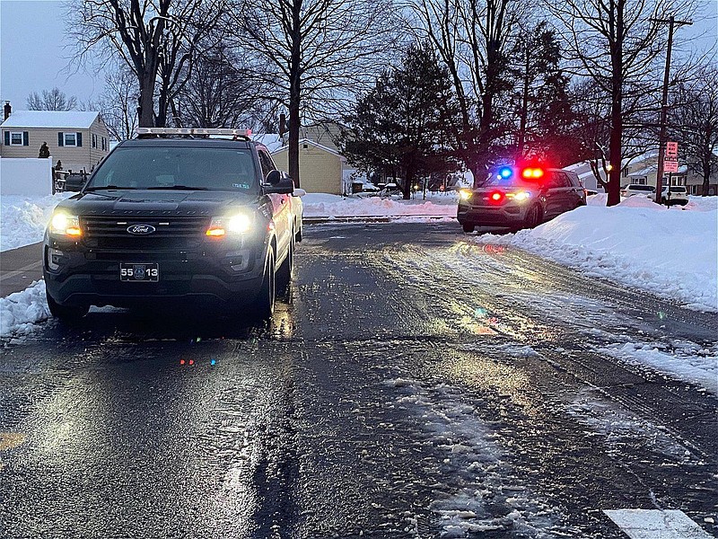 Police vehicles parked outside of Oak Park Elementary on Feb. 22, 2021, following the stabbing of a young boy and girl. 