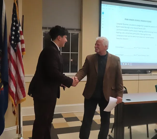 North Wales junior councilperson Braeden Bussman, left, receives his oath from council President Sal Amato on Tuesday, Feb. 27, 2024. 