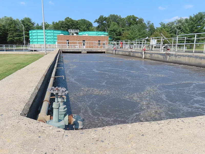 Bubbles can be seen on the top of water in a storage tank at Lansdale’s wastewater treatment plant. 