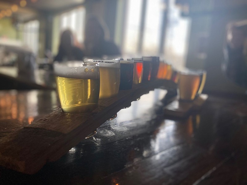 A couple orders a full flight of beer at Round Guys Brewing Company on Saturday afternoon. 