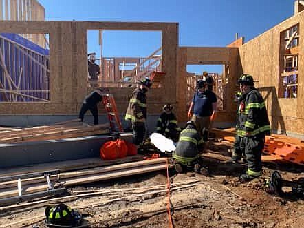 Crews from the Worcester Fire Department and Upper Gwynedd Fire Department rescue a 23-year-old male who fell into the basement of a home under constr