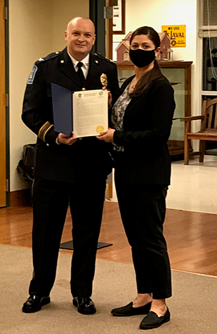 Towamencin Police Chief Tim Troxel, left, poses for a photo with Det. Jamie Pierluisse, right, during the Towamencin Board of Supervisors meeting on M