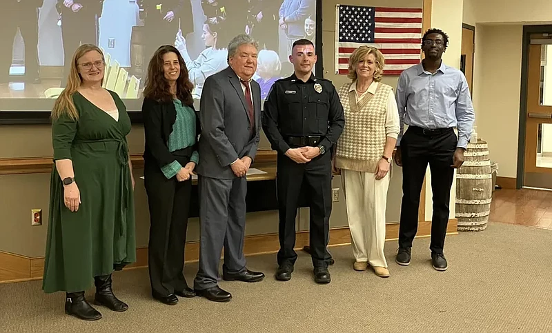 New Towamencin police Officer Brandon Kinest poses with the township supervisors after receiving his oath on Wednesday, Jan. 24, 2024. 