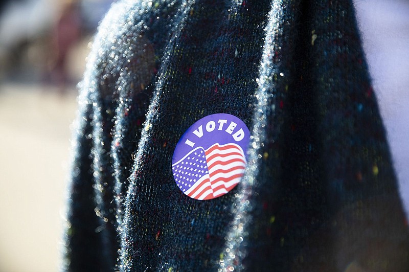 A Pennsylvania voter in Camp Hill wears an I Voted sticker on Election Day, Nov. 8, 2022. 