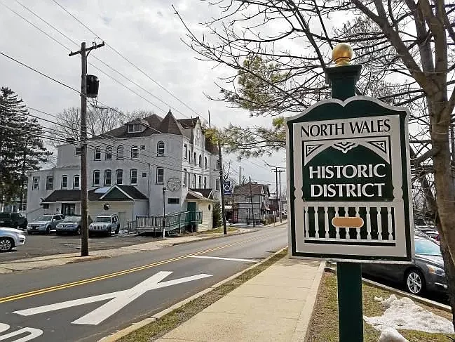 A sign indicating the borough’s historic district is seen on Walnut Street near the former North Wales Hotel and McKeever’s Tavern building in North W