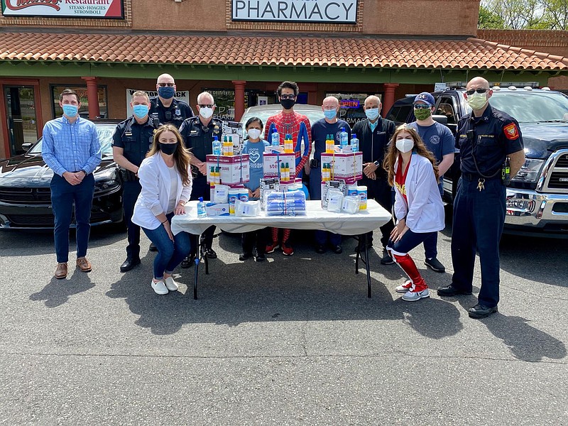 Members of the Lansdale Borough Police Department, Fairmount Fire Company and Volunteer Medical Service Corps of Lansdale pose with Skippack Pharmacy 