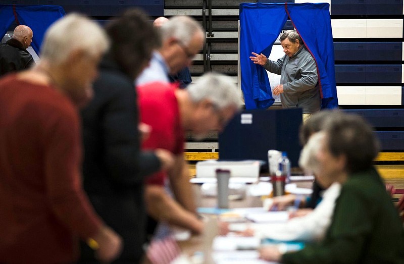 A voter steps from the voting booth Nov. 6, 2018, after casting his ballot in Doylestown, Pennsylvania. 