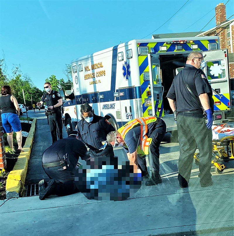 Emergency medical personnel from the Volunteer Medical Service Corps of Lansdale tend to the victim of Tuesday’s crash. 