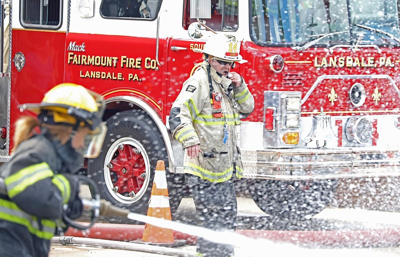 Members of the Fairmount Fire Company battle Lansdale Borough Officials during the 2019 Founders' Day festivities.