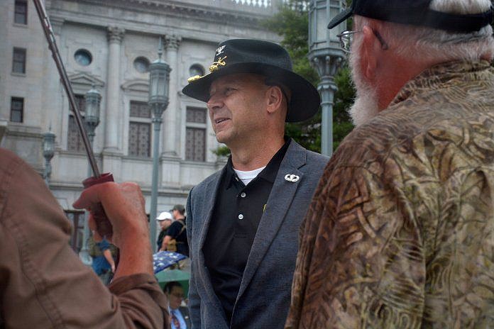 Sen. Doug Mastriano, R-Franklin, speaks with attendees on the Capital steps of a rally for gun rights on September 29, 2020. 