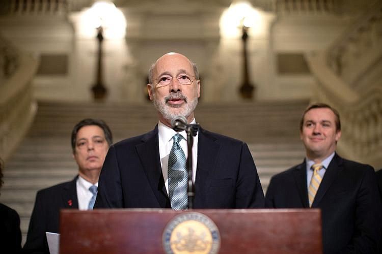 Pennsylvania Gov. Tom Wolf, flanked by Senate Minority Leader Jay Costa and House Majority Leader Bryan Cutler, announces his executive order establis