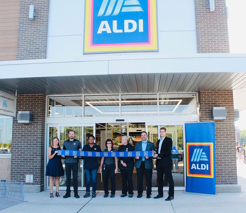 ALDI personnel stand with State Rep. Steve Malagari and Hatfield Township Commissioner Laura Thomas. 
