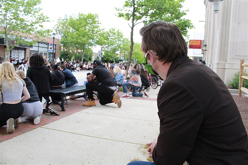 Lansdale Borough Mayor Garry Herbert, right, kneels with demonstrators during a Black Lives Matter rally on June 2. 