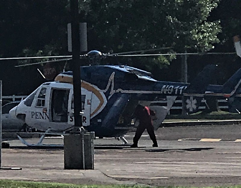 A victim is loaded into the medevac. 