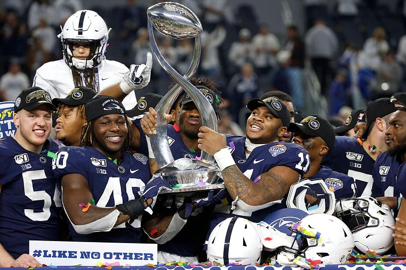 Penn State celebrates following the team's 53-39 win over Memphis Dec. 28, 2019, in the NCAA Cotton Bowl college football game in Arlington, Texas. 