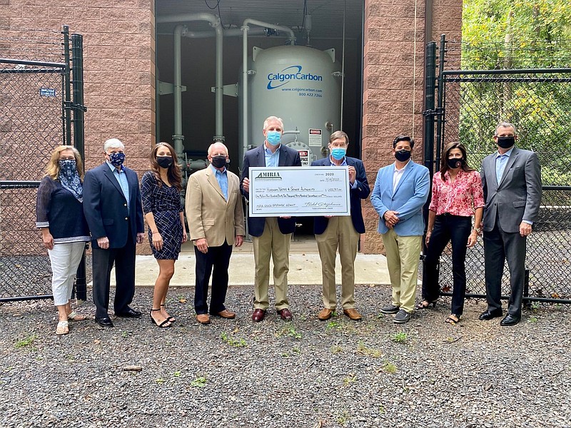 Rep. Todd Stephens, chairman of the Military Installation Remediation and Infrastructure Authority, presents a check to Horsham Water & Sewer at the P