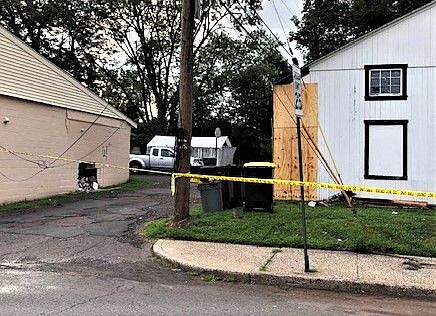 Damage can be seen to both the garage and the wall, following the crash. 