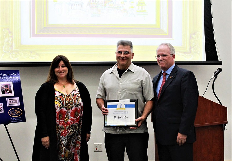 Councilwoman Carrie Hawkins Charlton, left, with Joe Kicinski, center, and Council President Denton Burnell, right. 