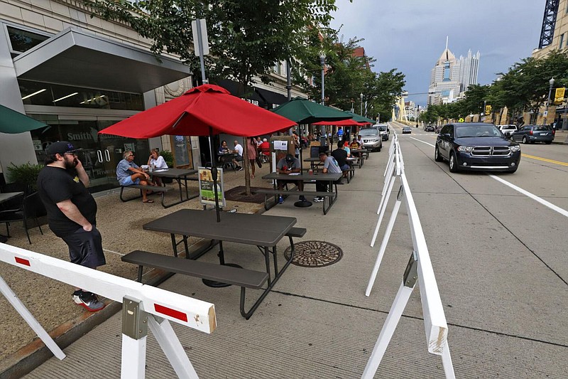 Additional outdoor seating extends into the street outside of Mike's Beer Bar on the Northside of Pittsburgh on Sunday July 12, 2020. 