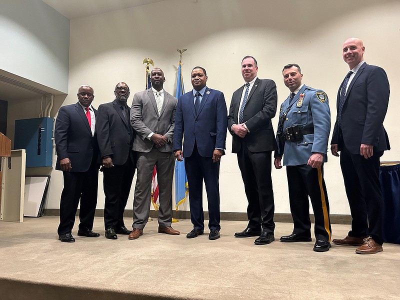 Mayor Marty, center, and Police Chief James Sarkos, second from right, with new Capts. Mark Benjamin, Donnell Holland, Henry White III, Kevin Fair and Dean Dooley.