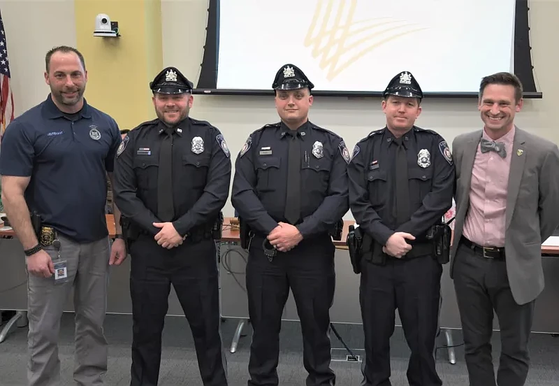 New Lansdale police officers Richard Schenk, John Ruel and James Gray police with police Lieutenant Ryan Devlin, far left, and Mayor Garry Herbert, far right, after receiving their oaths and badges on March 15, 2023. (Photo courtesy of Lansdale PD)