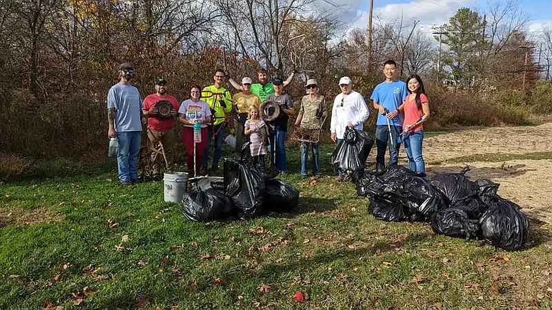 Members of the “Friends of Lansdale Parks” group pose with trash collected from Stony Creek park in Lansdale during a park cleanup event on Saturday, Nov. 5 2022. (Photo courtesy of Friends of Lansdale Parks)