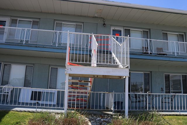 An exterior stairway on the north side of the Seaspray condominiums has been closed off with red tape.