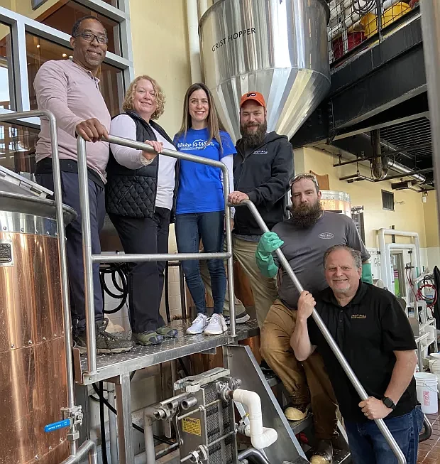 From left to right: Cedric Clark, Wish Maker for Make-A-Wish; Cindy Reiss-Clark Make-A-Wish Philadelphia, Delaware & Susquehanna Valley board of directors; Laura Klatzkin, Make-A-Wish development director for Delaware; John Panasiewicz, Iron Hill Brewery logistics manager; Mike Sobel, Iron Hill Brewery brewer; Mark Edelson, Iron Hill co-founder & VP of Beer. (Credit: Iron Hill Brewery)