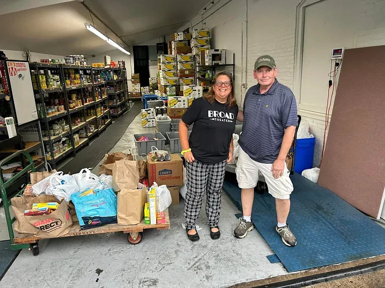 Lansdale Open Gardens Tour organizer Jenniah Caldwell, left, and Manna on Main Street Food Resources and Operations Director Jim Lynch pose with several hundred pounds of food donated by garden tour attendees earlier this month. (Credit: Jenniah Caldwell)