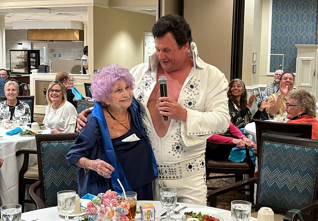 Lois Satalof, 101, is serenaded by Elvis impersonator Dean Garofolo.
