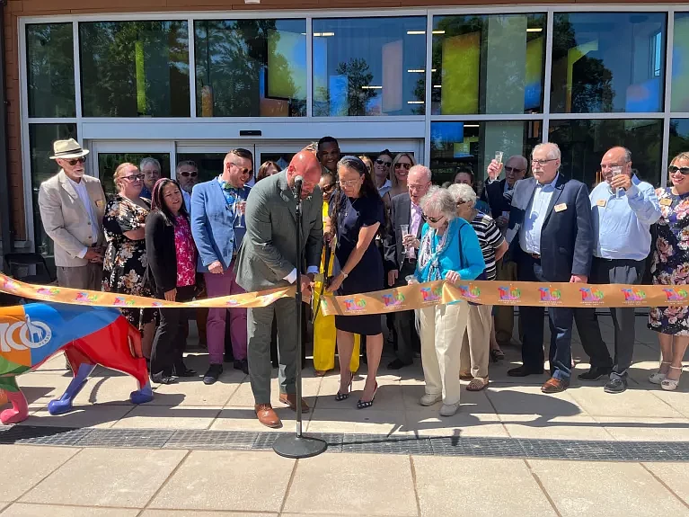 Elmwood Park Zoo officials are seen smiling and toasting on May 31, 2024 as CEO and Executive Director Al Zone and Paige Engro cut the ribbon to the zoo’s new welcome center and Frank and Paige Engro Veterinary Health Center. (Credit: Rachel Ravina / MediaNews Group)