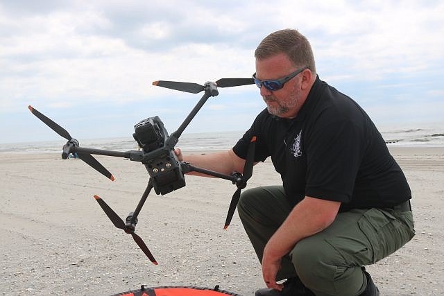 Ocean City Police Lt. Mark Pancoast holds a drone being used by the police department.