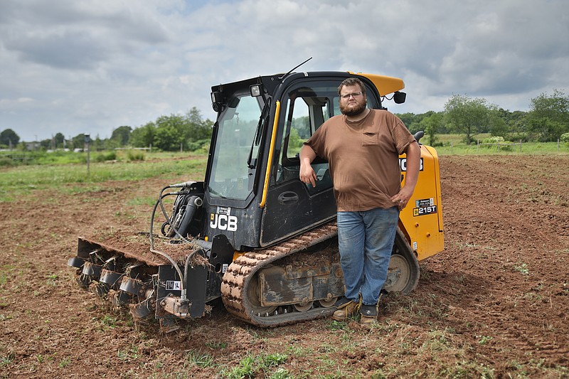 Charlie A. Harris of CLC Property Maintenance, on site at Garden of Health Food Bank in Hatfield Township, where he volunteers labor and equipment to till and prepare acres of farmland for produce, which is donated to local food banks.